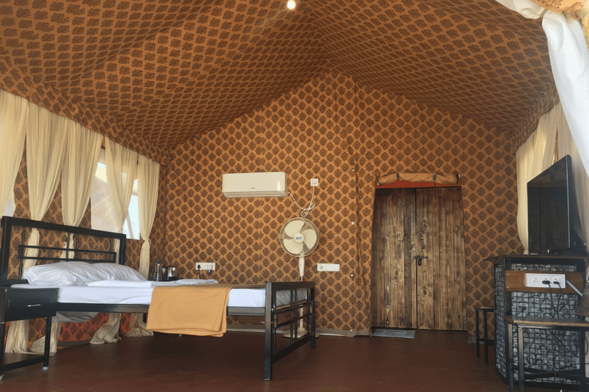 Tent interior with comfortable bed